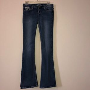 Bootcut jeans with jewels on the pockets.